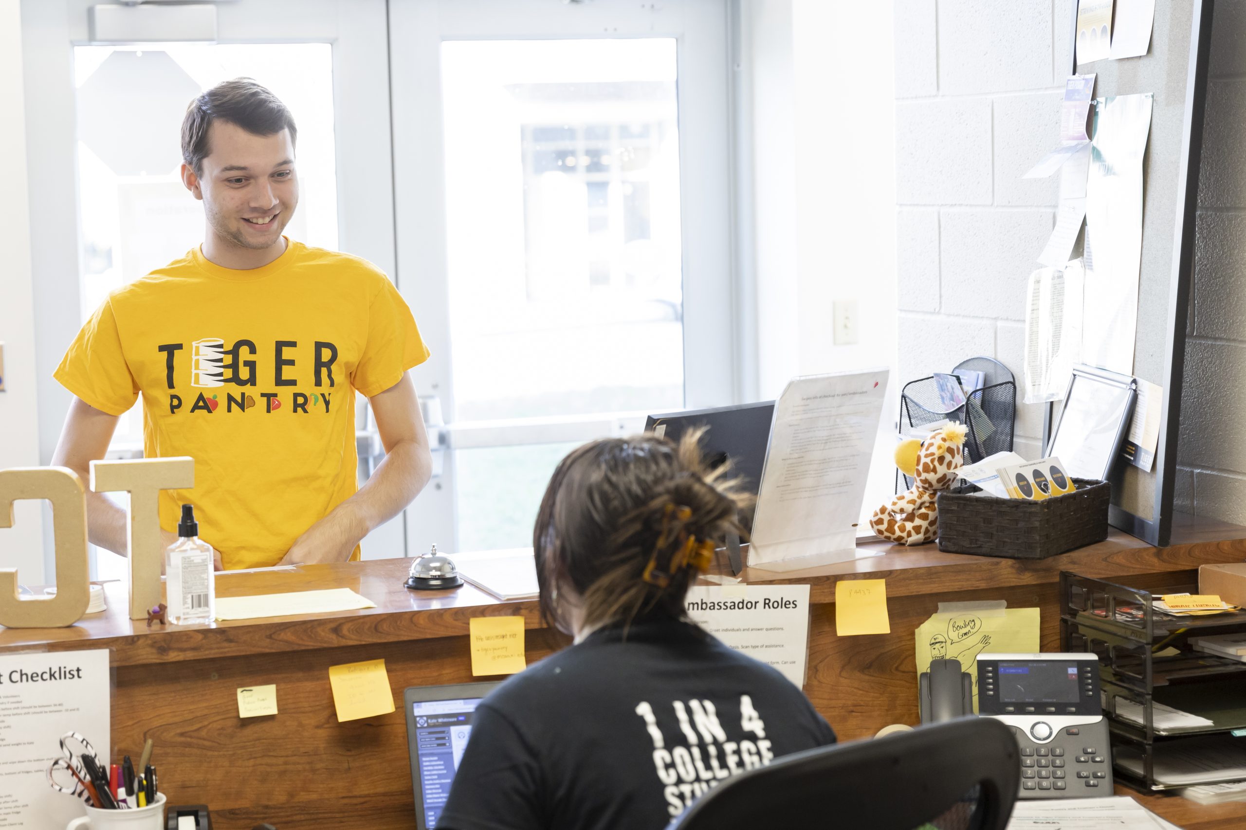Student is welcomed at Tiger Pantry front desk