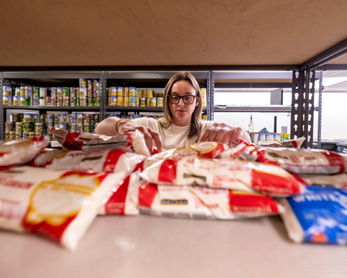 Student helping at the Tiger Pantry.